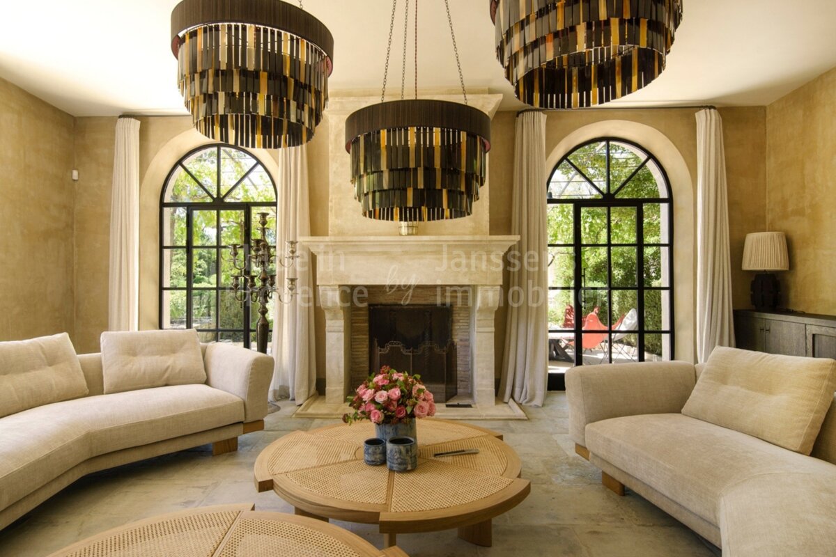 A living room with a fireplace and a sign that says janssen