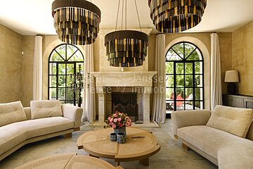 A living room with a fireplace and a sign that says janssen