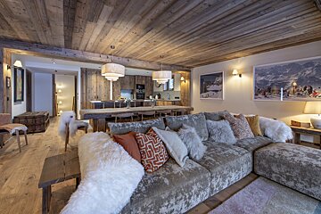 A living room with a couch and a painting on the wall