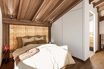 A modern rustic bedroom features a sloped wooden ceiling, patterned headboard, white built-in wardrobe, and wood flooring, creating a warm, cozy retreat.