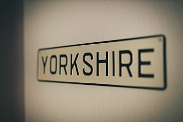 A sign on a wall that says yorkshire on it
