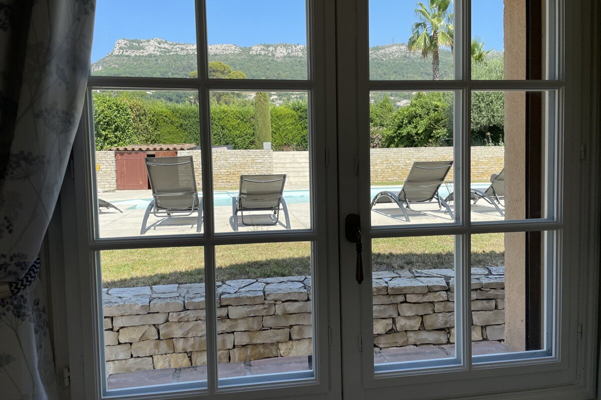 A view of a swimming pool through a window