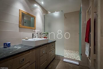 A bathroom with the number 80 on the wall