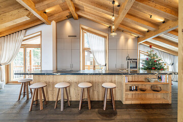 A bathroom with wooden walls and a bathtub