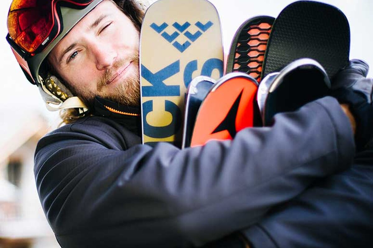 A man holding a snowboard that says ck on it