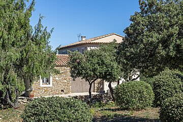 A house with a roof that has a antenna on it