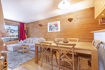 A bathroom with yellow tiles and a white sink