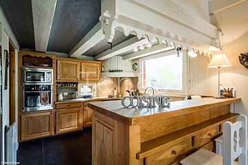 The word cuisine is on a counter in a kitchen