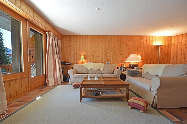 A living room with a couch and a coffee table