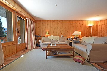A living room with a couch and a coffee table