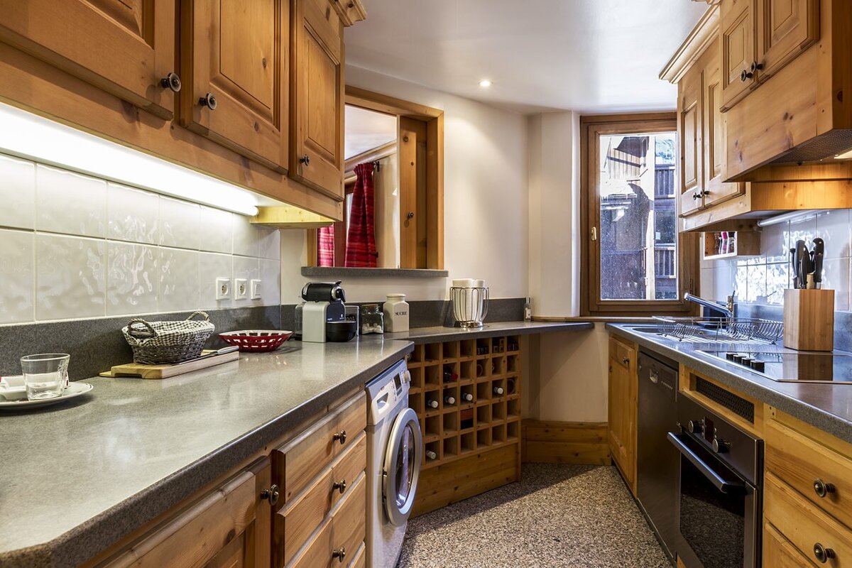 A book called schmidt is on a shelf next to a bed