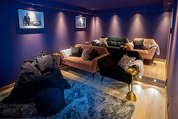 A room with purple walls and purple furniture
