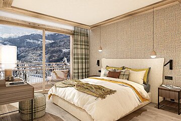 A bedroom with a large bed and a view of the mountains