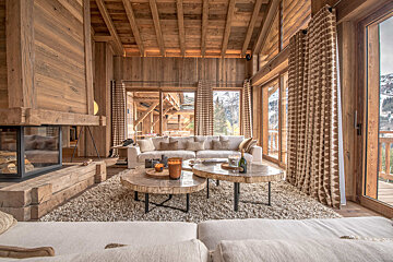 A living room filled with furniture and a fireplace