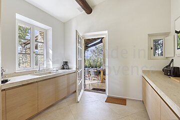 A kitchen with the words made in provence on the wall