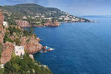 An aerial view of a cliff overlooking the ocean