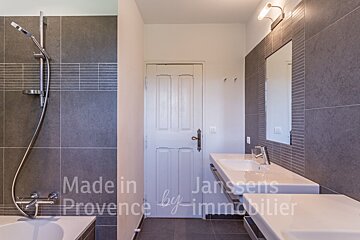 A bathroom with the words made in provence by immobilier on the wall