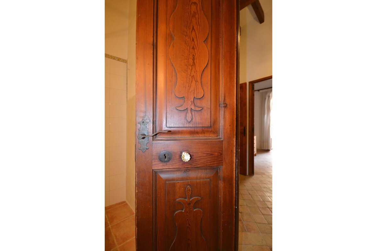 A wooden door with a fancy design on it