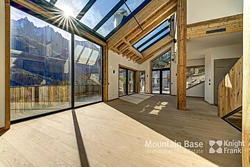 A room with a lot of windows and the words mountain base knight frank on the bottom