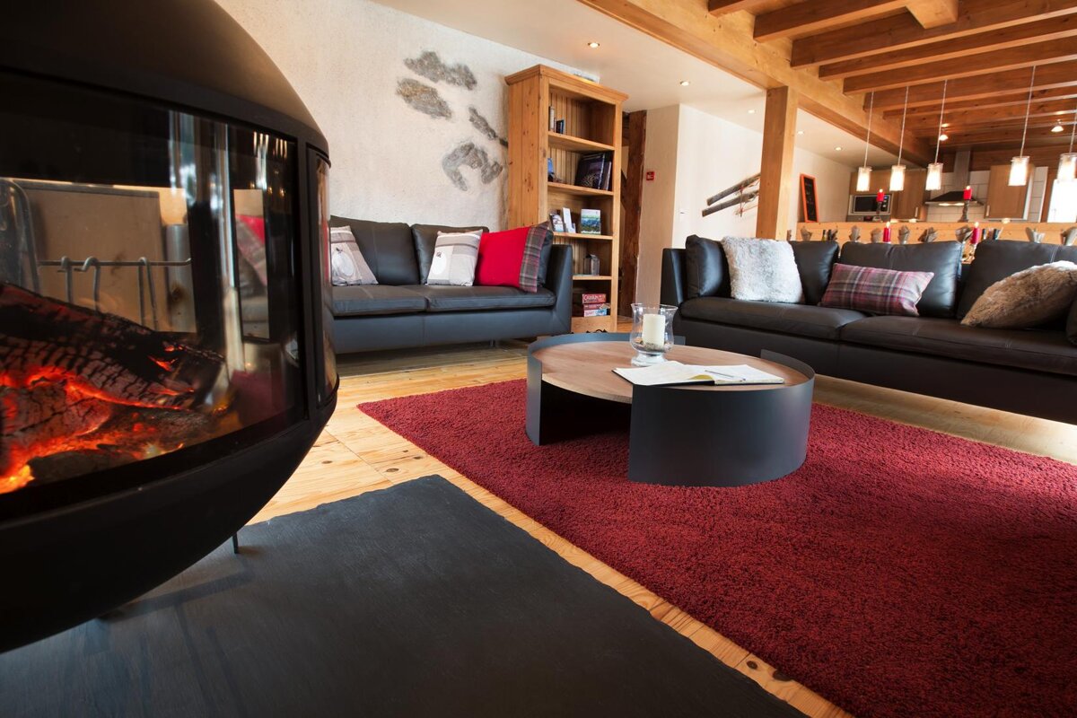 A living room filled with furniture and a fireplace