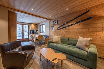A living room with a couch and a picture on the wall that says france