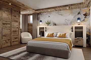 A bedroom with a large bed and a chair
