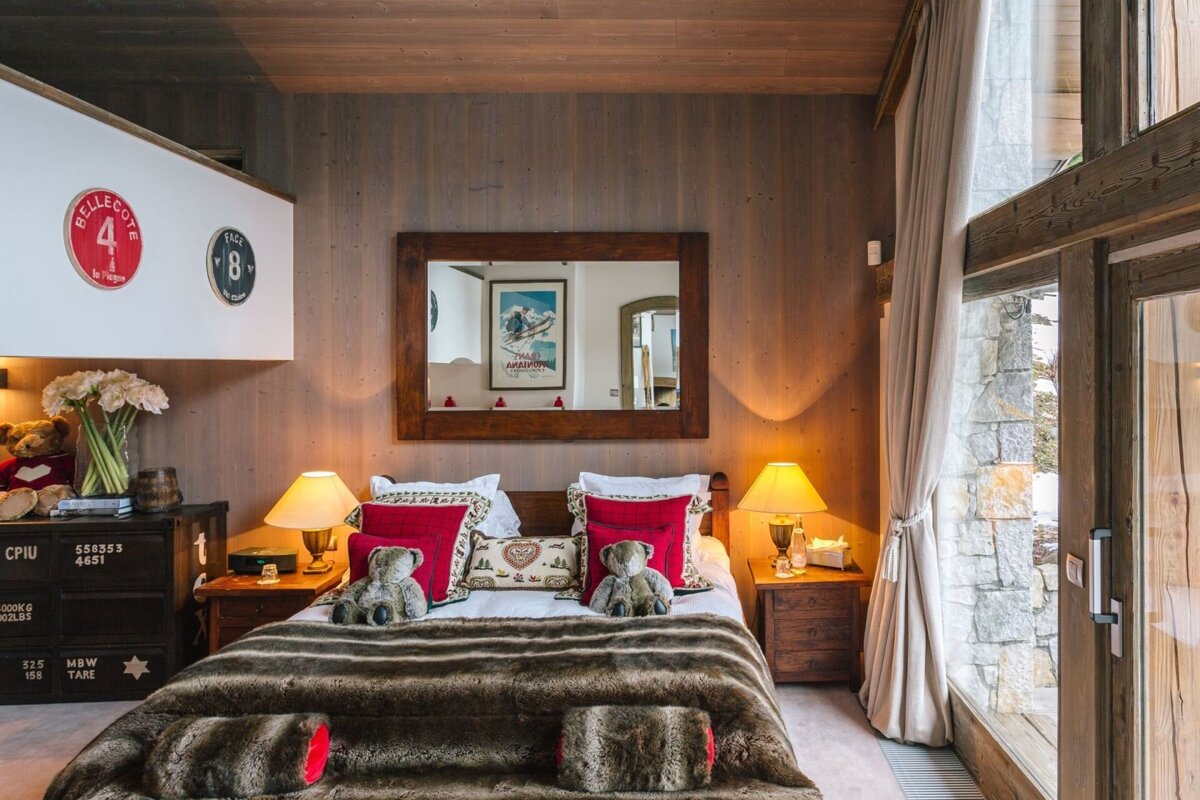 A bedroom with a bed and a nightstand with the number 4 on it