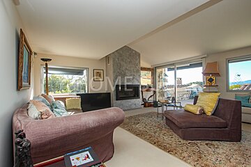 A living room with a fireplace and a sign that says home