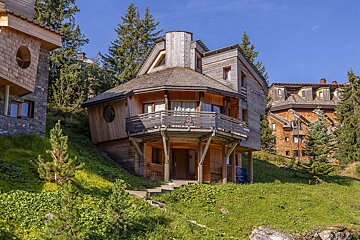 A wooden alpine building with a 
