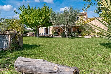 A house with a large lawn in front of it