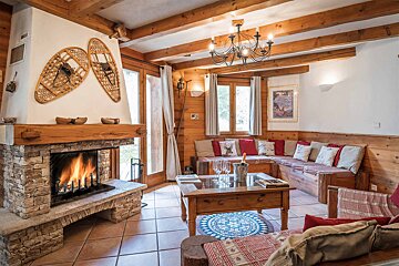 A living room with a fireplace and a couch