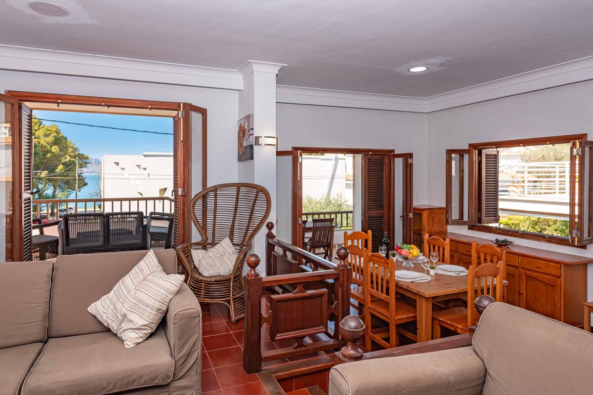 A living room with a couch a chair and a table