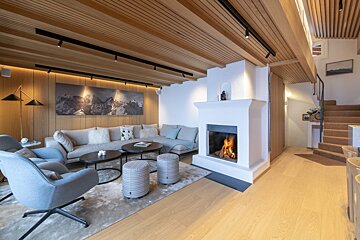 A living room with a fireplace and a couch