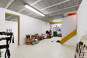 A room with a staircase and a sign that says ' alpine ' on it