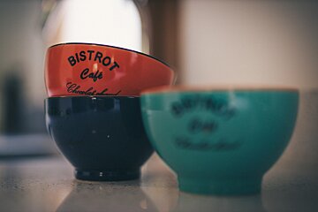 Three bistrot cafe bowls are stacked on top of each other