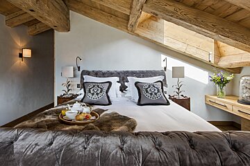 A bed with a tray of food on it