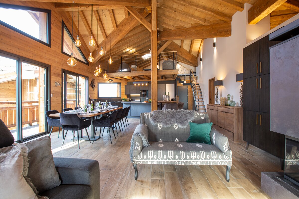 A living room with a couch that has a pattern on it