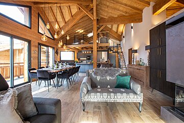 A living room with a couch that has a pattern on it