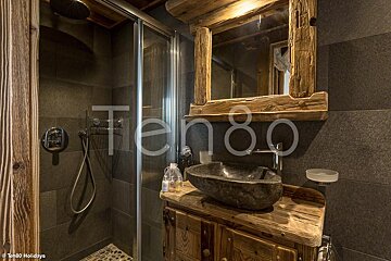 A bathroom with a sink and a mirror that says ten80