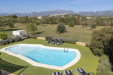A large swimming pool with mountains in the background