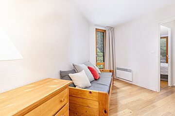 A view of a ski resort with mountains in the background