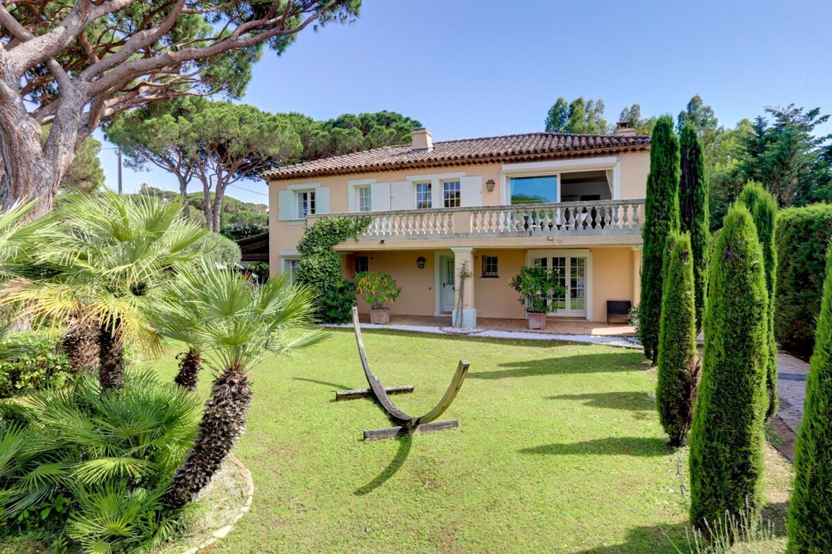 A large house with a large lawn in front of it