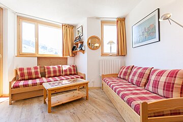 A living room with a couch and a coffee table