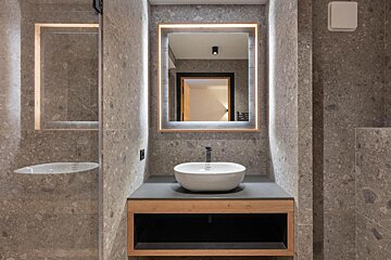 A bathroom with a sink and a mirror