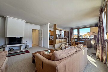 A living room with a fireplace and a couch