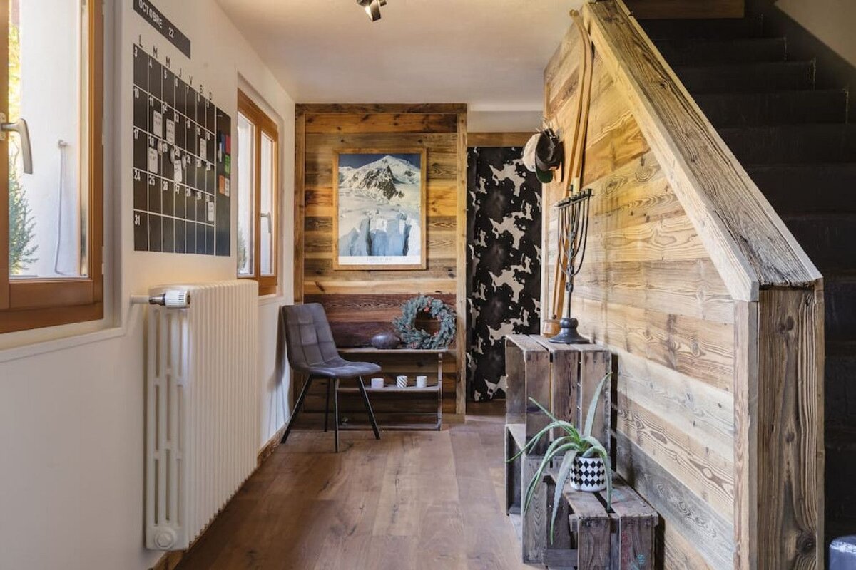 A hallway with a calendar on the wall that says october 13