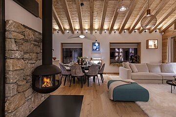 A living room with a fireplace and a couch