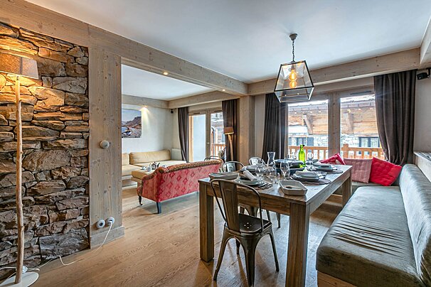 A living room with a couch and a painting on the wall