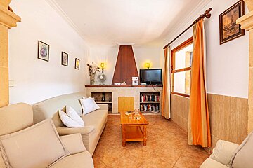 A living room with a couch and a television