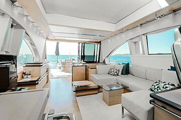 A living room on a boat with a couch and a table